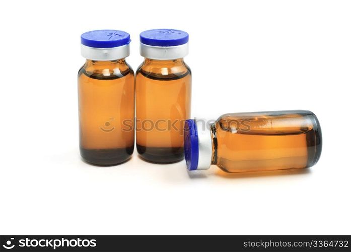 three glass bottles with medicine on white background