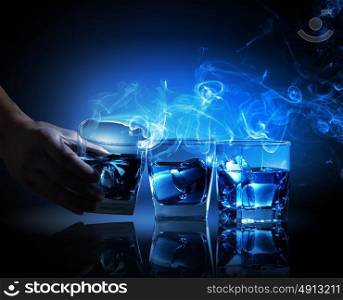 Three glasses of blue cocktail. Three glasses of blue cocktail with fume going out