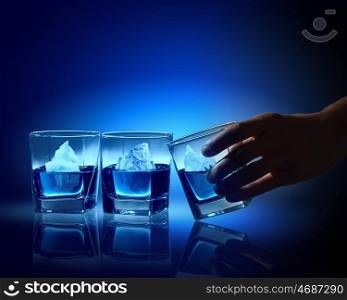 Three glasses of blue liquid. Three glasses of blue liquid with icebergs in