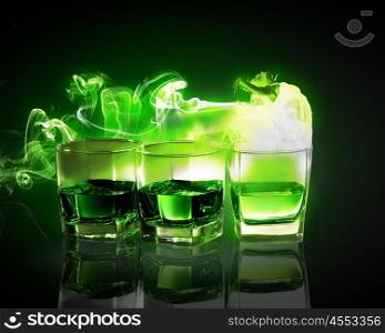 Three glasses of green absinth. Three glasses of green absinth with fairy