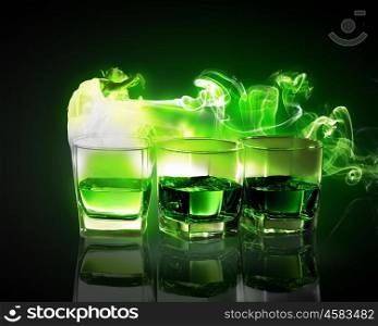 Three glasses of green absinth. Three glasses of green absinth with fairy