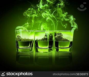 Three glasses of green absinth with nature illustration in