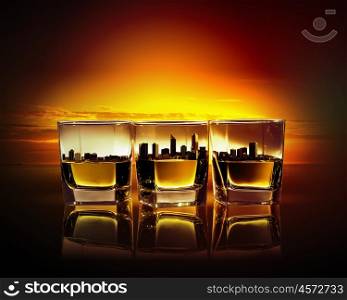 Three glasses of whiskey. Image of three glasses of whiskey with city illustration in