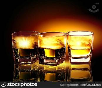 Three glasses of whiskey with nature illustration in