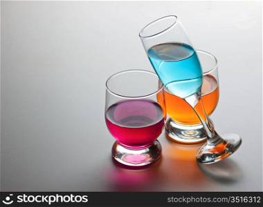 three glasses with drinks