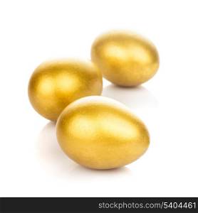 Three golden eggs isolated on white background