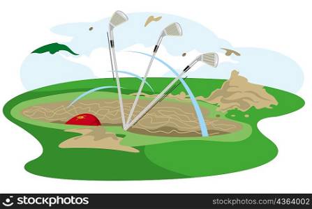 Three golf clubs in a sand trap