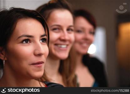 Three gorgeus women smiling
