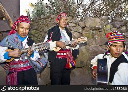 Three guitarists performing, Lake Titicaca, Taquile Island, Puno, Peru
