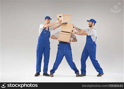 Three guys holding the paper boxes