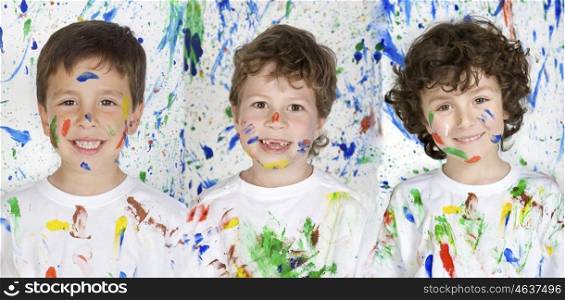 Three happy and painted children stained paint