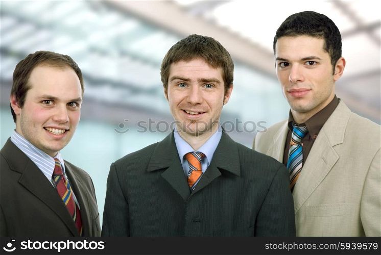 three happy business men together as a team
