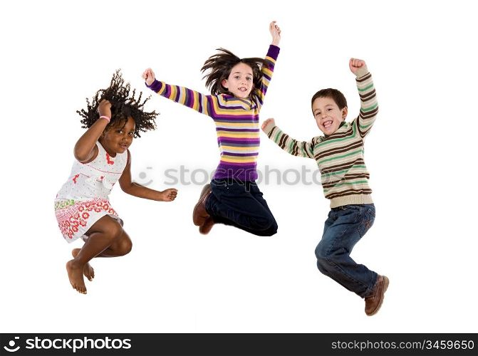 Three happy children jumping at once on a white background