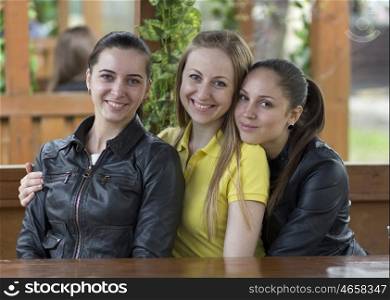 Three happy friends, beautiful girls