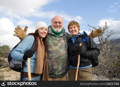 Three hikers standing on the trail