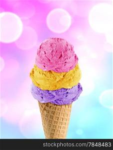 three Ice cream scoops in the cone with abstract light background.. Ice Cream cone