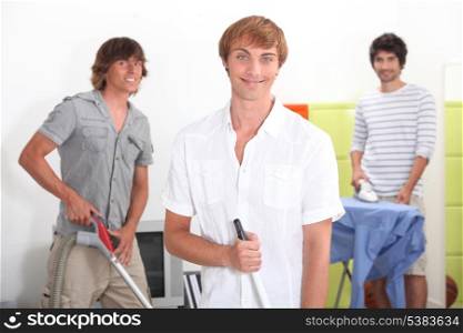 Three lads doing their chores