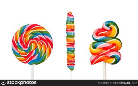 Three lollipops with many colors and different shapes isolated on a white background