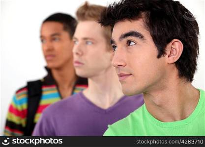 Three male student in line.