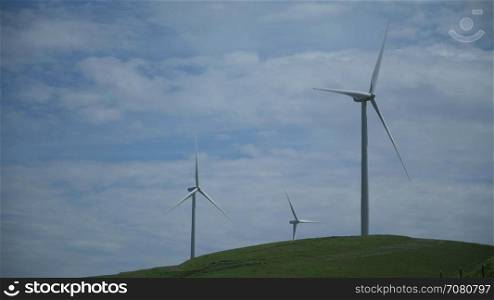 Three massive turbines in a Californian wind farm