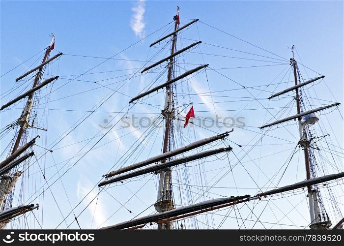 Three masts fom a sailboat