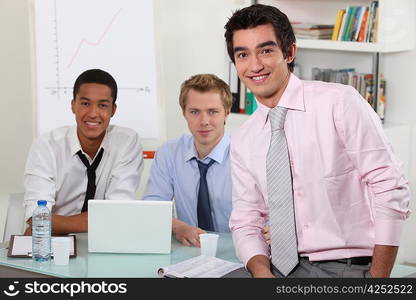 Three men in an office