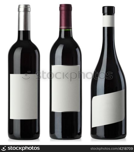 Three merged photographs of different shape red wine bottles with blank labels. Separate clipping paths for bottles and labels included.