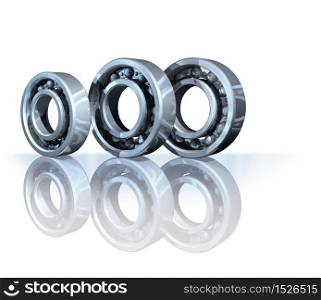 Three metal ball bearings on white reflective background. Ball bearings on reflective background isolated