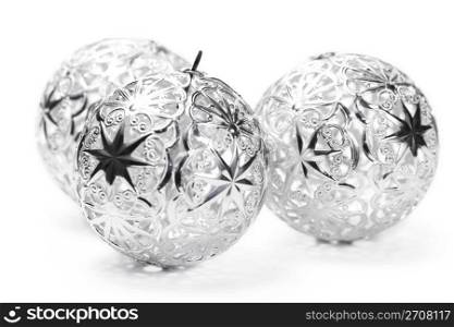 three metal christmas balls. three metal christmas balls on white background