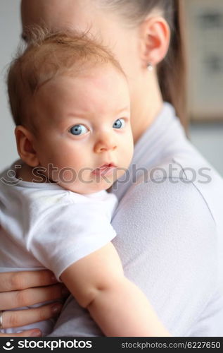 Three months old baby boy with his mother