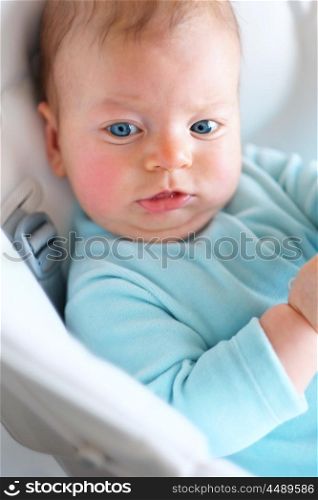 Three months old baby in chair