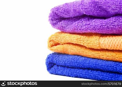Three multi-colored towels on white background