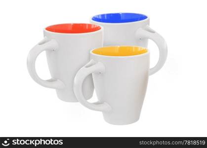 Three multicolored mugs, isolated on white