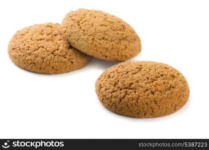 Three oatmeal cookies isolated on white