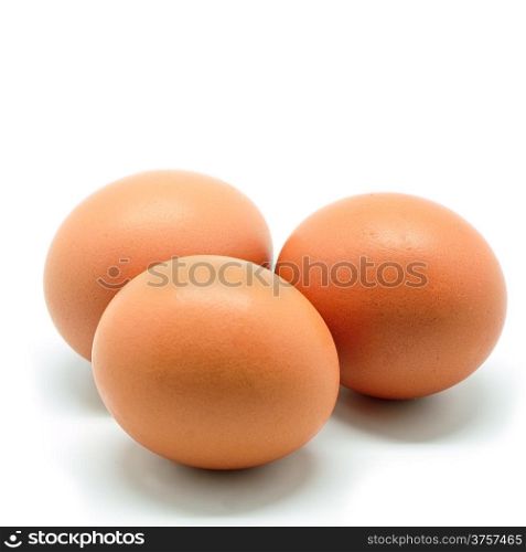 Three of brown chicken egg isolated on a white background
