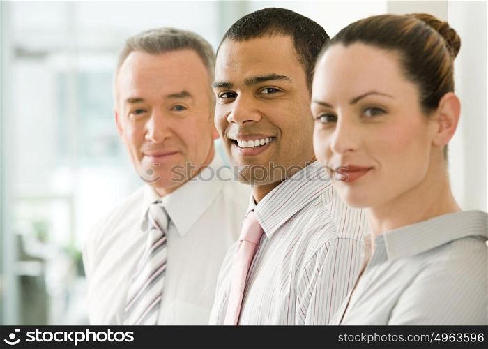 Three office workers in a row