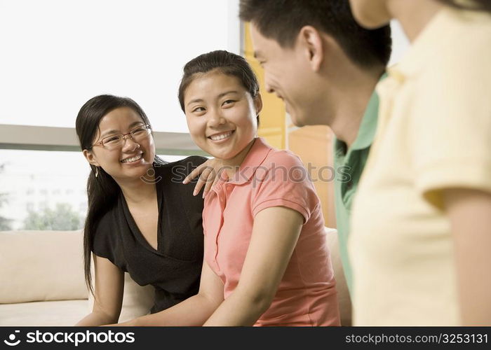 Three office workers smiling