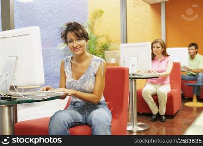 Three office workers working in an office