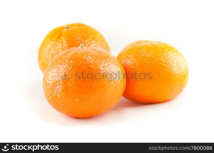 Three oranges on the white background