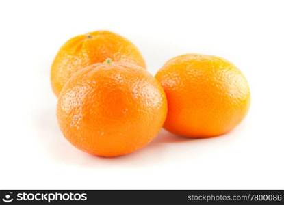 Three oranges on the white background