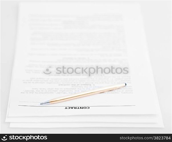 three pages of sales contract and golden pen on white background