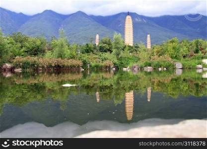 Three pagodas and pond in Dali, China