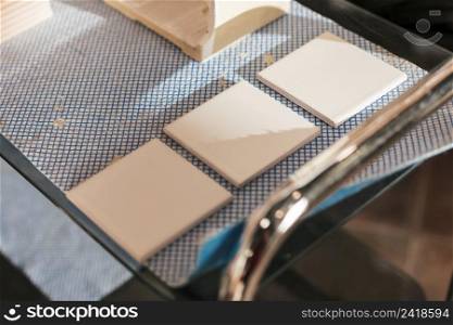 three painted ceramic tiles table