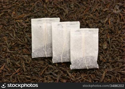three paper bags with tea