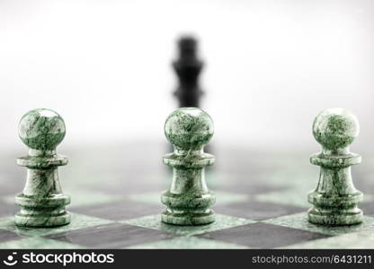 Three pawns in a raw standing in front of king shape.