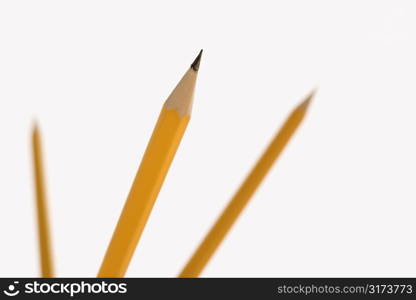 Three pencils pointing in air with selective focus.