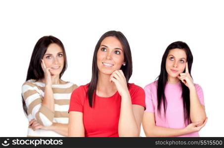 Three pensive brunette girl isolated on a over red background
