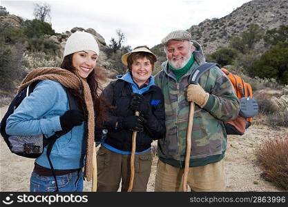 Three people hiking, portrait