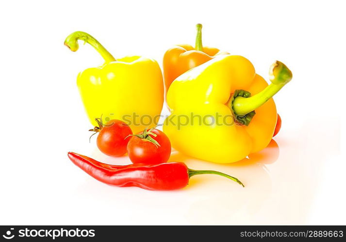 Three peppers over white