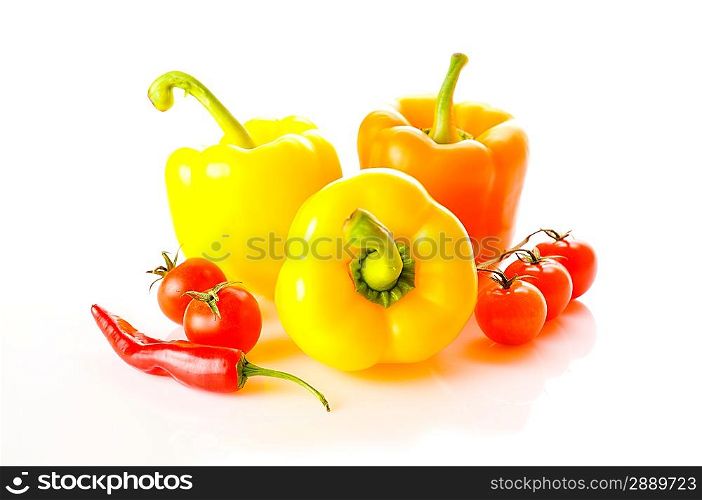 Three peppers over white